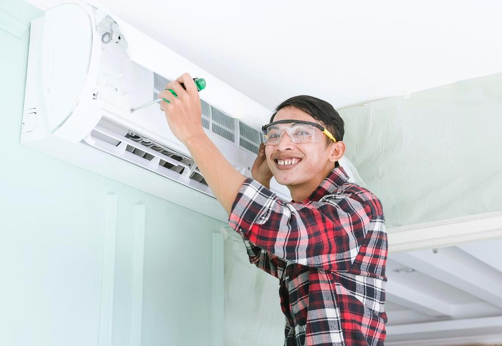 Technician installing insulation in walls